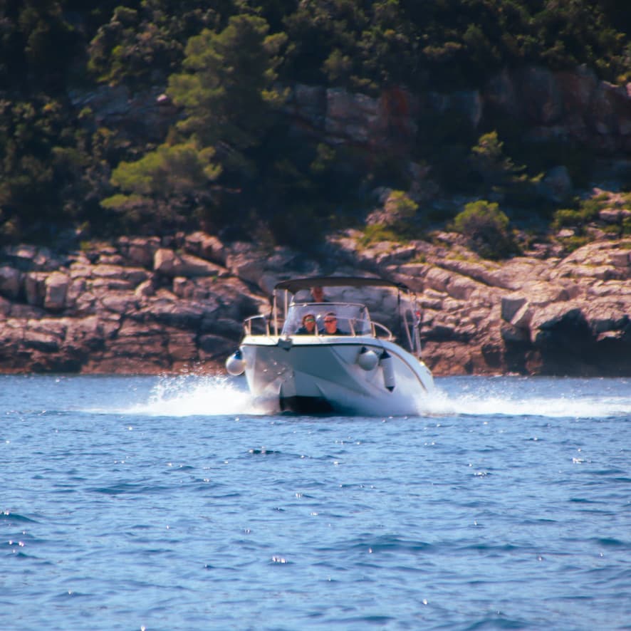 Private luxury speedboat tour cruising near Dubrovnik Old Town walls